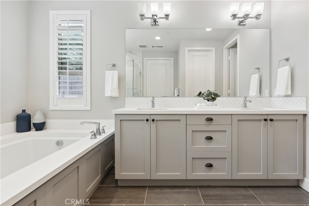 27 Alienta Lane Rancho Mission Viejo, CA 92694 - Photo 19 of 75 a bathroom with a sink double vanity and a mirror