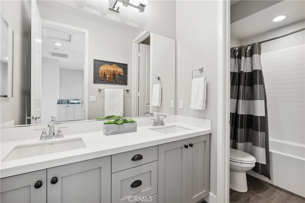 27 Alienta Lane Rancho Mission Viejo, CA 92694 - Photo 29 of 75 a bathroom with a sink a toilet and shower