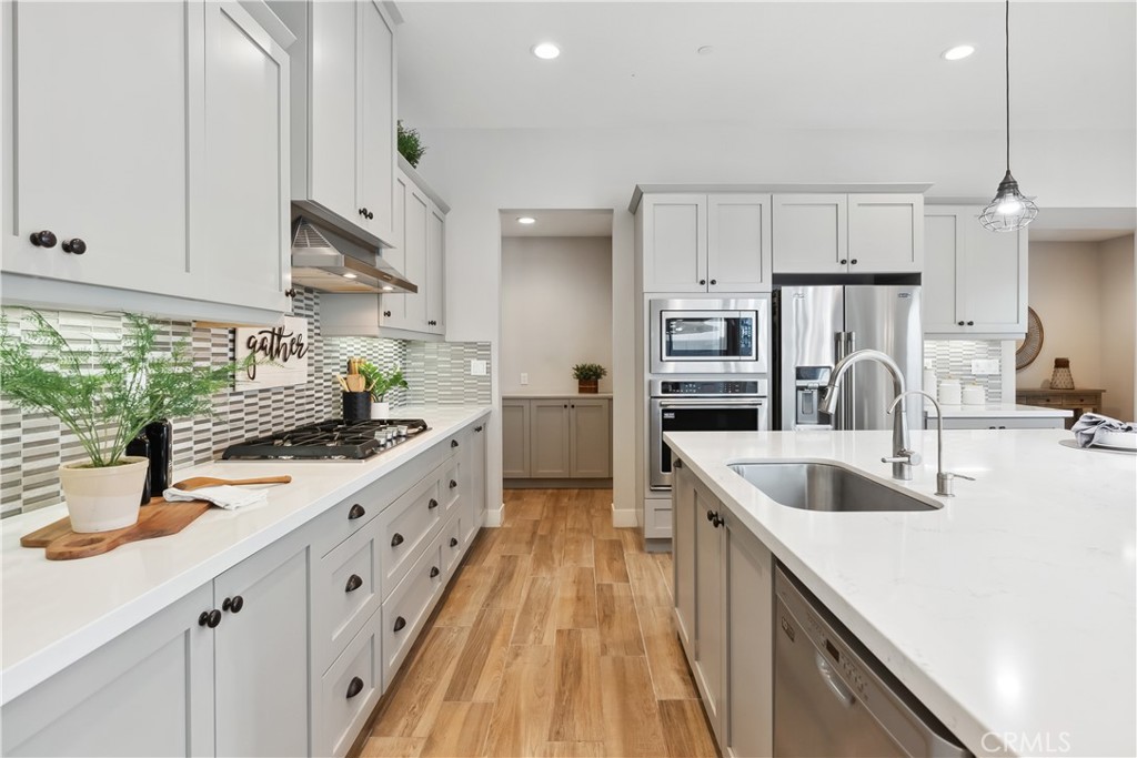 27 Alienta Lane Rancho Mission Viejo, CA 92694 - Photo 4 of 75 a kitchen with stainless steel appliances granite countertop a sink stove and refrigerator