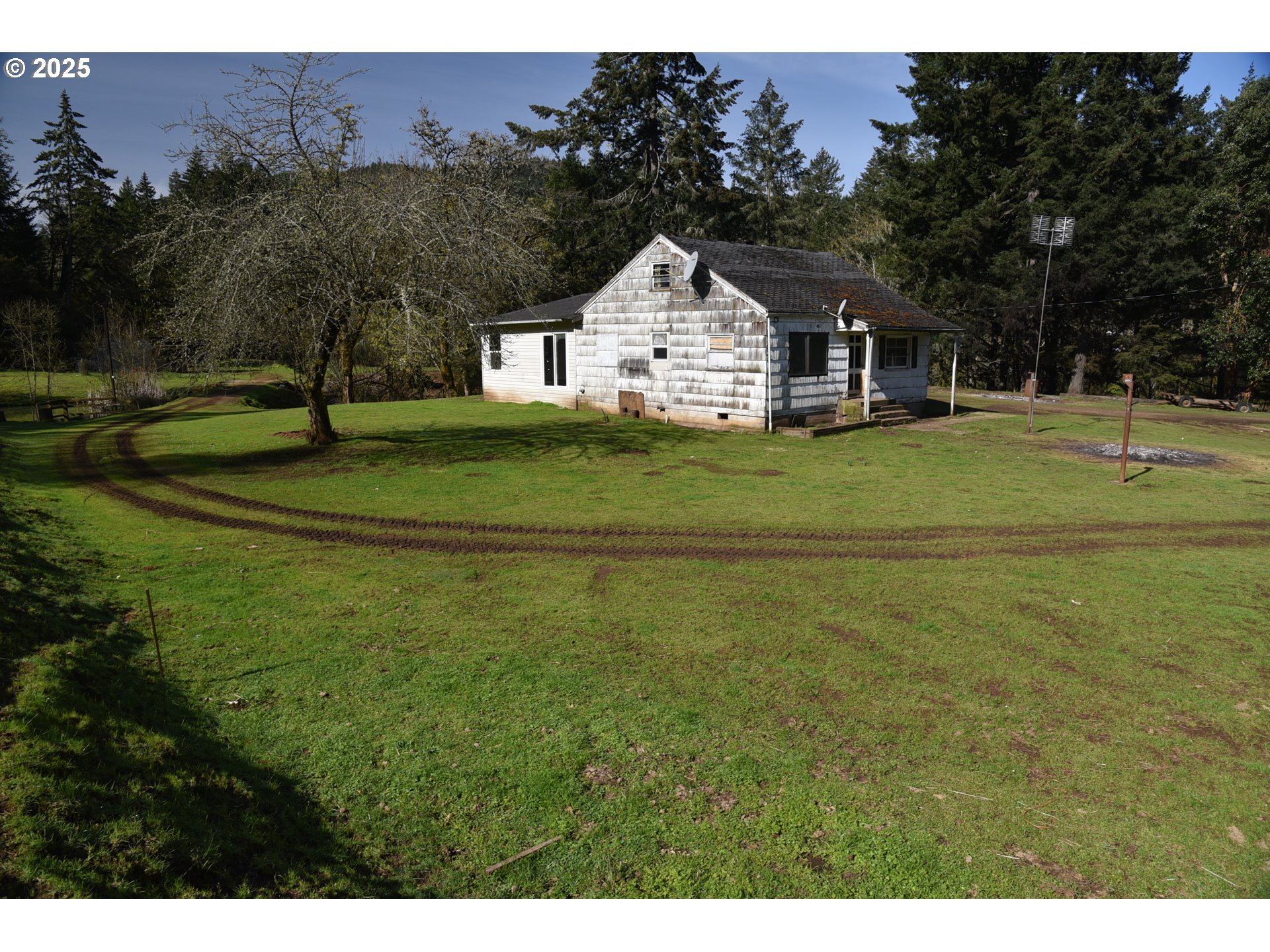 3890 Mill Creek Road Dallas, OR 97338 - Photo 20 of 36 a view of a house with a yard