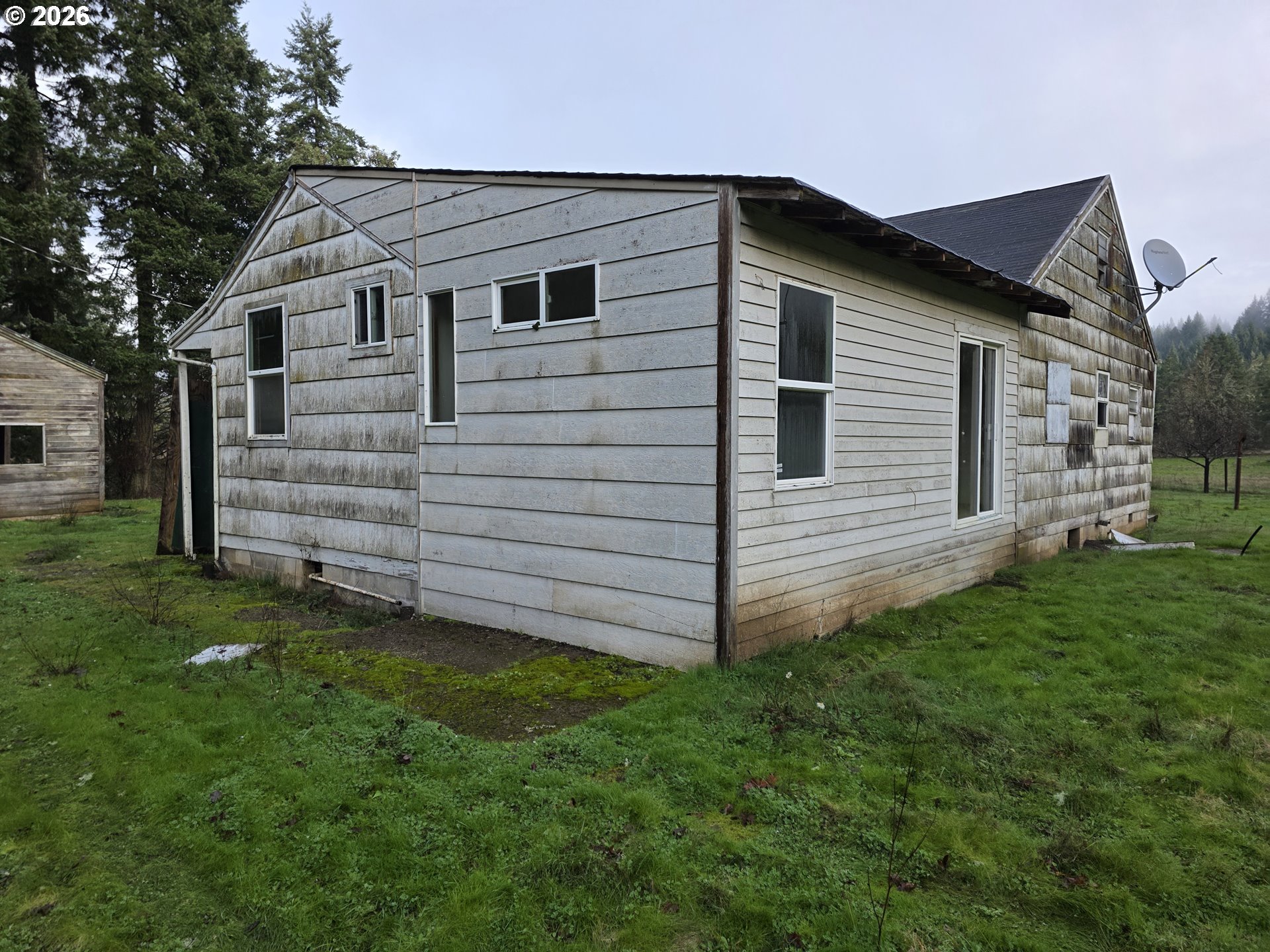 3890 Mill Creek Road Dallas, OR 97338 - Photo 25 of 36 a view of a house with a yard