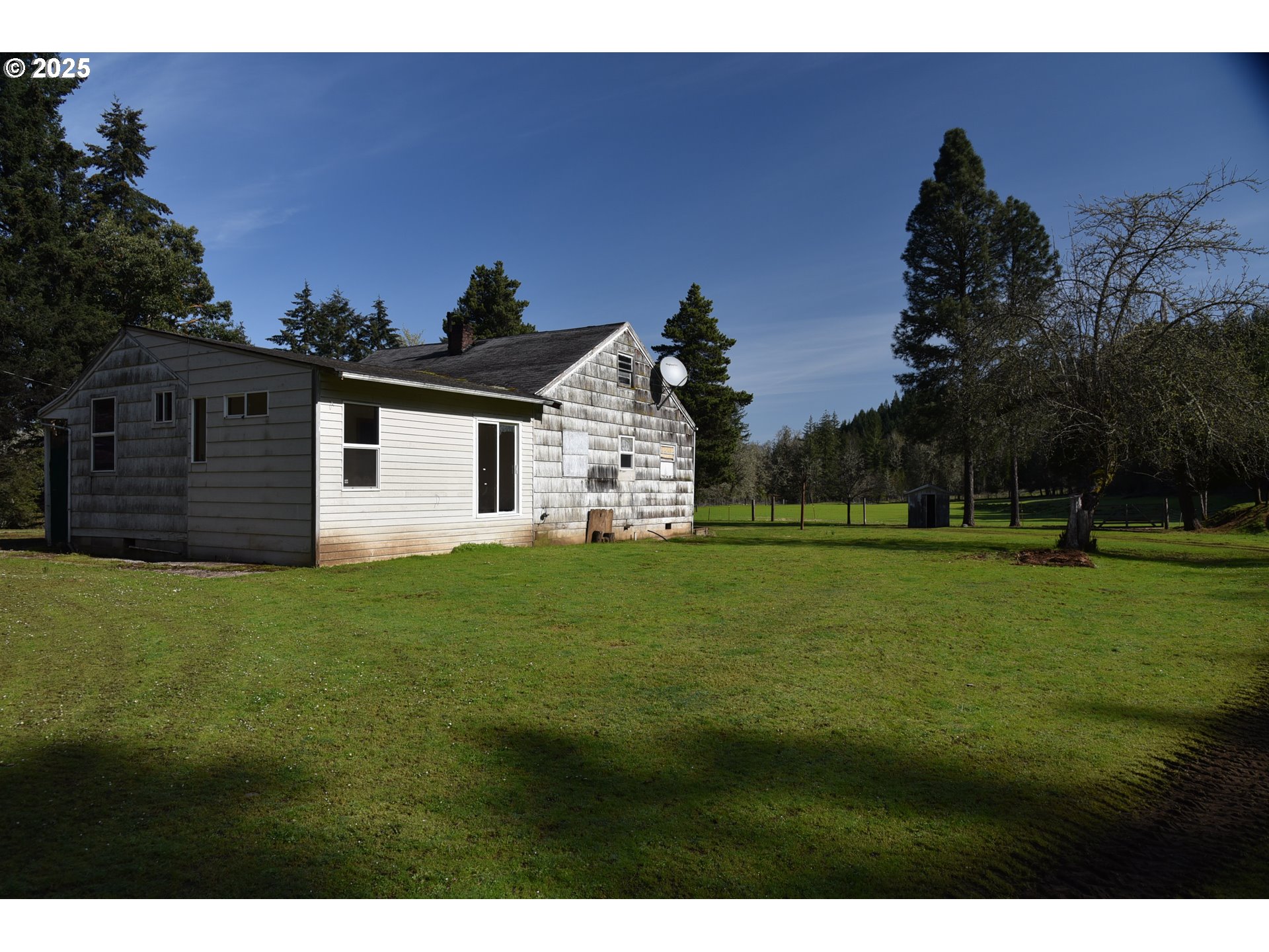 3890 Mill Creek Road Dallas, OR 97338 - Photo 3 of 36 a front view of a house with a yard