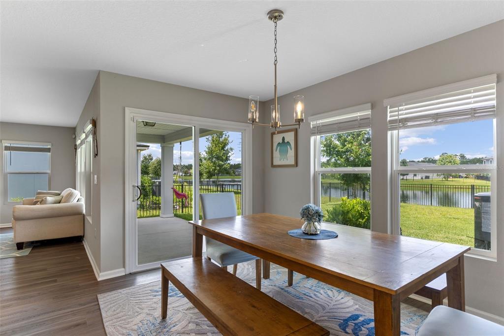 562 Meadow Ridge Drive St. Augustine, FL 32092 - Photo 21 of 61 a view of a dining room with furniture window and wooden floor