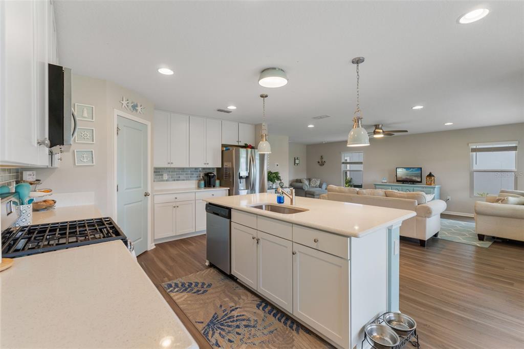 562 Meadow Ridge Drive St. Augustine, FL 32092 - Photo 22 of 61 a kitchen with counter top space appliances and cabinets
