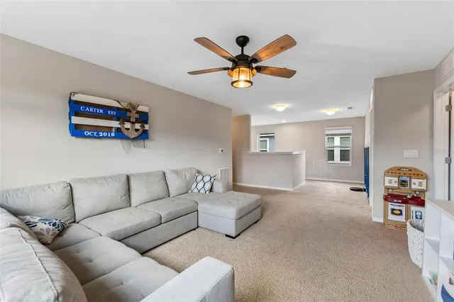 a spacious bedroom with a bed and a tv