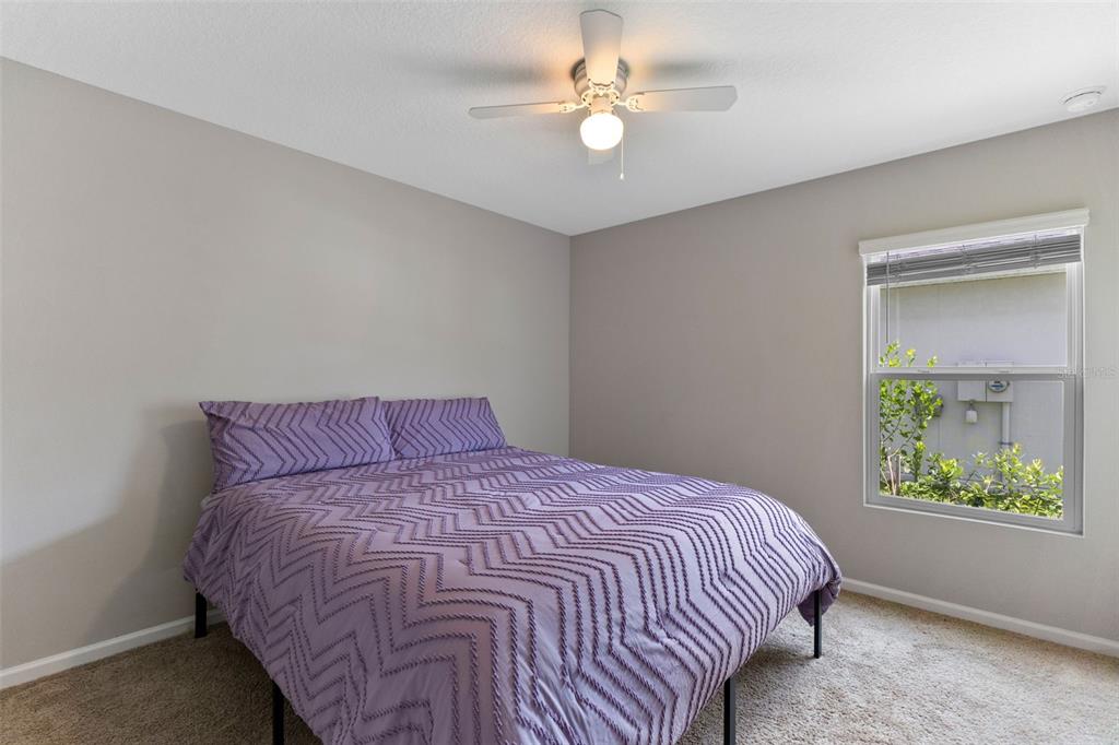 562 Meadow Ridge Drive St. Augustine, FL 32092 - Photo 30 of 61 a bedroom with a bed and a window