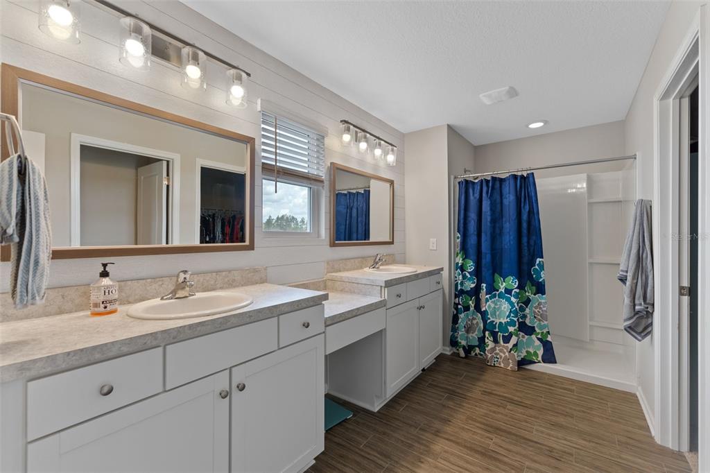 562 Meadow Ridge Drive St. Augustine, FL 32092 - Photo 34 of 61 a bathroom with a sink and a mirror