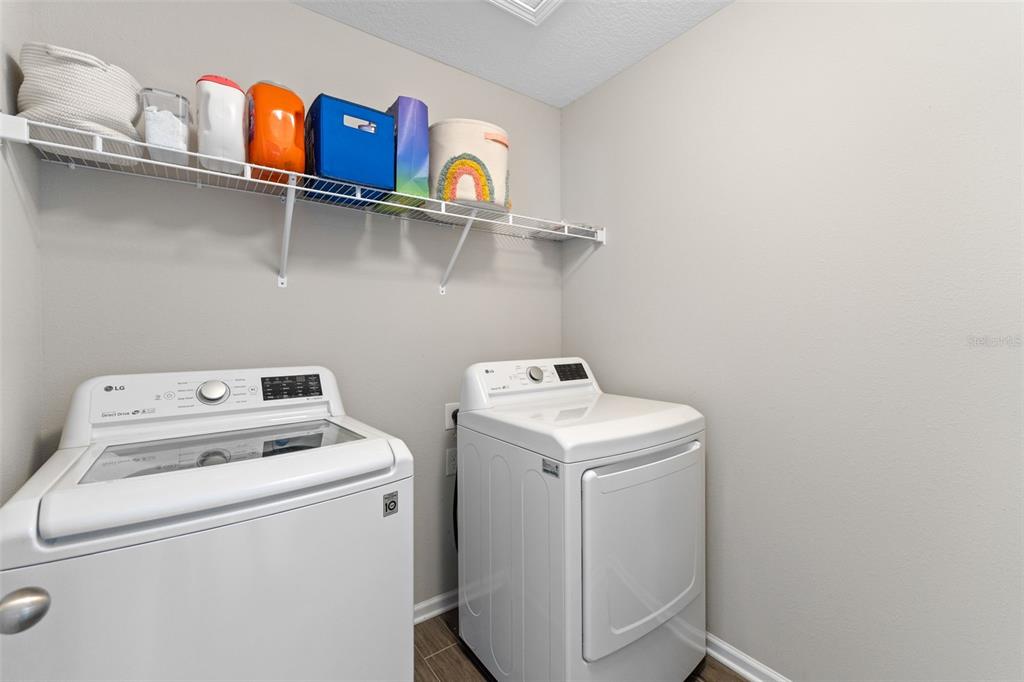 562 Meadow Ridge Drive St. Augustine, FL 32092 - Photo 36 of 61 a utility room with dryer and washer