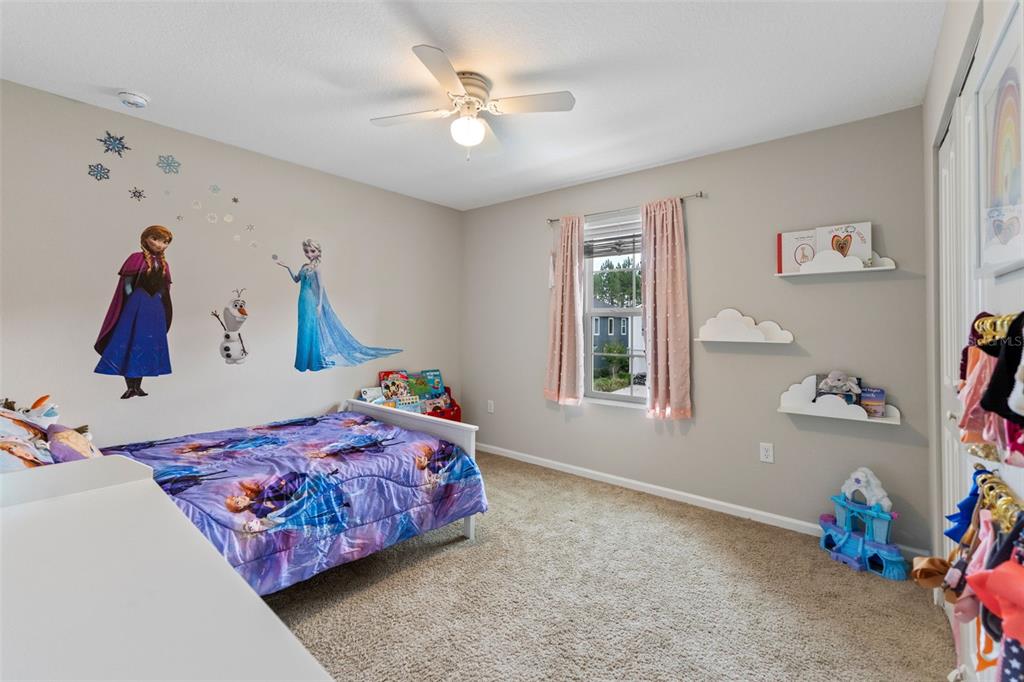 562 Meadow Ridge Drive St. Augustine, FL 32092 - Photo 38 of 61 a bedroom with a bed and a window