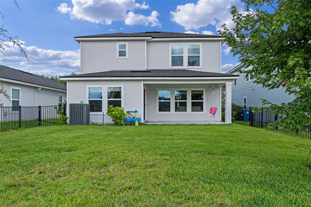 562 Meadow Ridge Drive St. Augustine, FL 32092 - Photo 41 of 61 a view of a yard in front of a house with plants and large tree