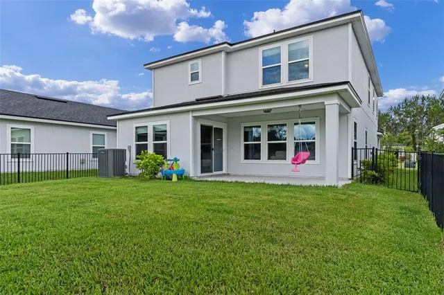 an aerial view of a house with a ocean view