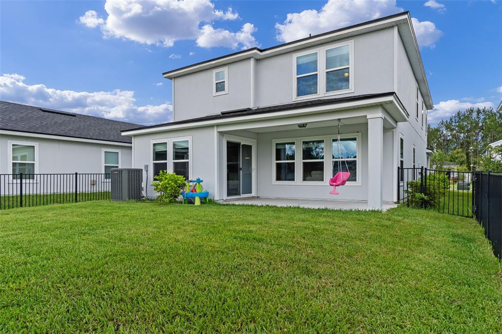 562 Meadow Ridge Drive St. Augustine, FL 32092 - Photo 42 of 61 a view of a house with backyard and garden