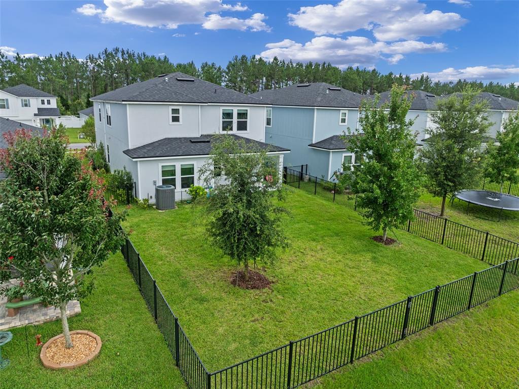 562 Meadow Ridge Drive St. Augustine, FL 32092 - Photo 45 of 61 a aerial view of a house with a yard table and chairs