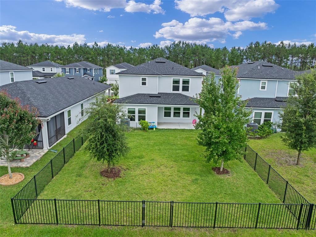 562 Meadow Ridge Drive St. Augustine, FL 32092 - Photo 46 of 61 a aerial view of a house with a yard