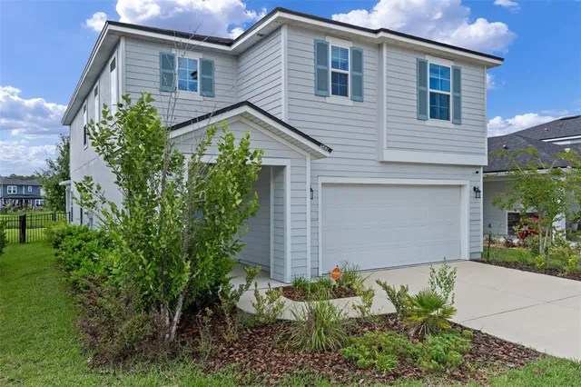 a view of a hallway view with wooden floor and staircase
