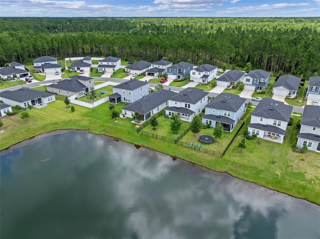 562 Meadow Ridge Drive St. Augustine, FL 32092 - Photo 53 of 61 an aerial view of a house with a garden and swimming pool