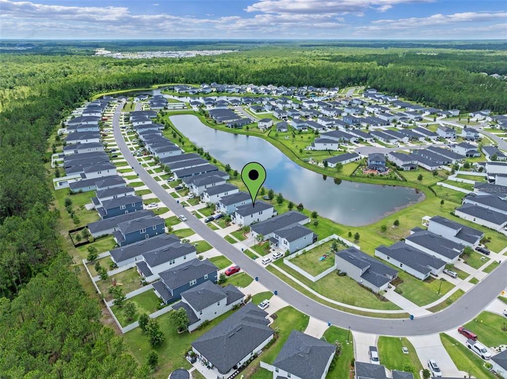 562 Meadow Ridge Drive St. Augustine, FL 32092 - Photo 57 of 61 an aerial view of a house with a yard