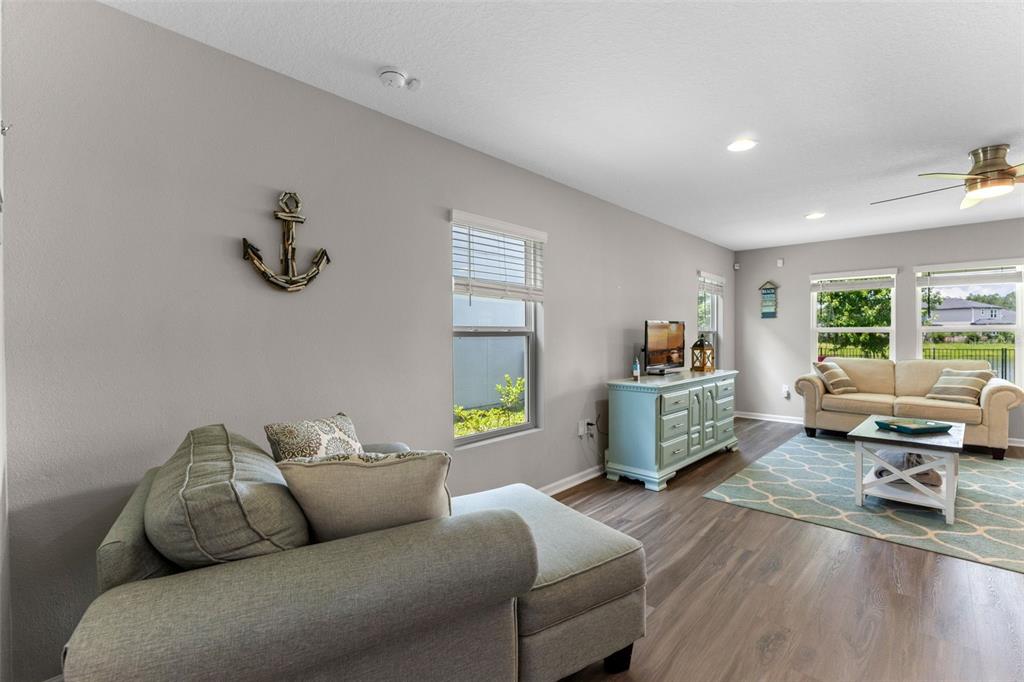 562 Meadow Ridge Drive St. Augustine, FL 32092 - Photo 10 of 61 a living room with furniture and a wooden floor