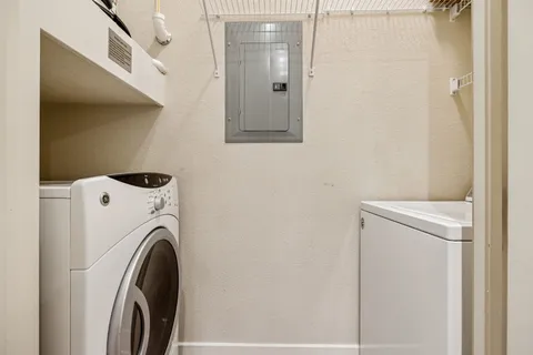 a utility room with dryer and washer