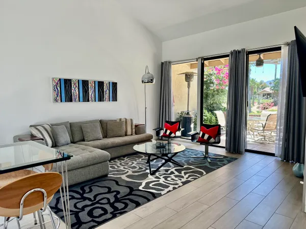 a living room with furniture and a large window