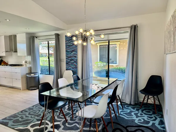 a dining room with furniture and window