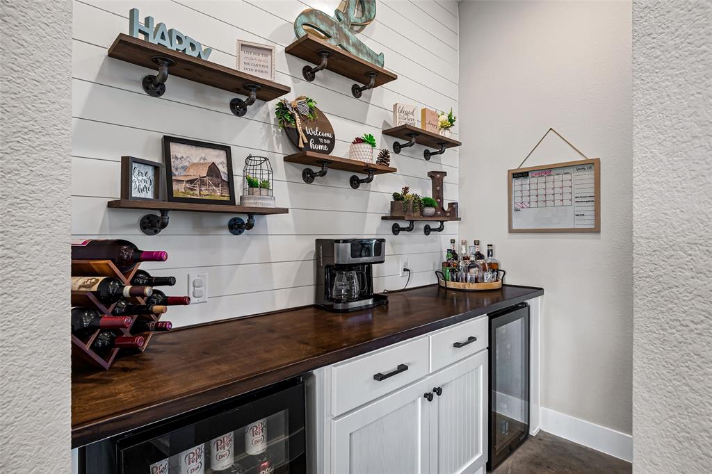 310 Runyan Rnch Road Tolar, TX 76476 - Photo 18 of 40 a view of a kitchen with cabinets and wooden floor
