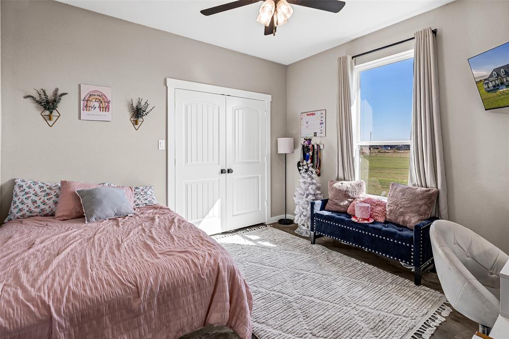 310 Runyan Rnch Road Tolar, TX 76476 - Photo 31 of 40 a bedroom with a bed and large window