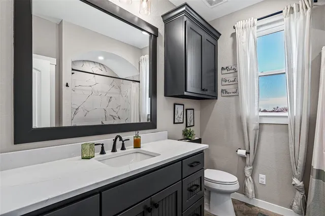 a utility room with cabinets