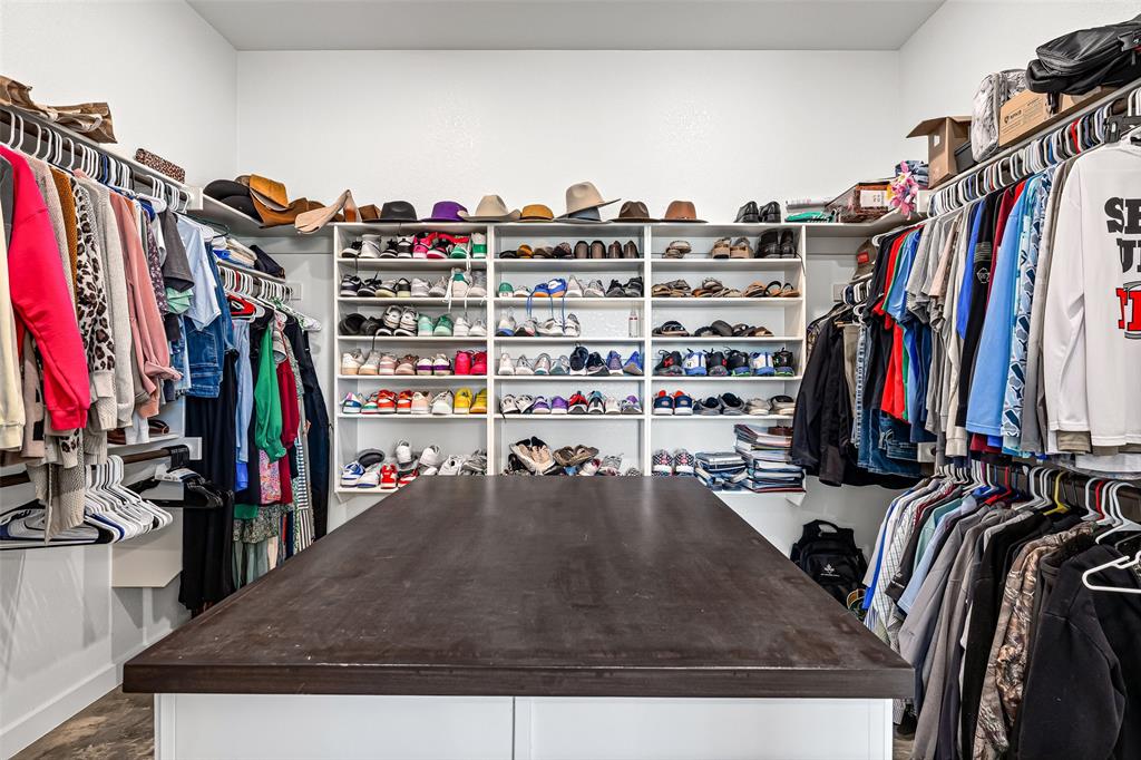 310 Runyan Rnch Road Tolar, TX 76476 - Photo 39 of 40 a view of walk in closet with clothes and shoes