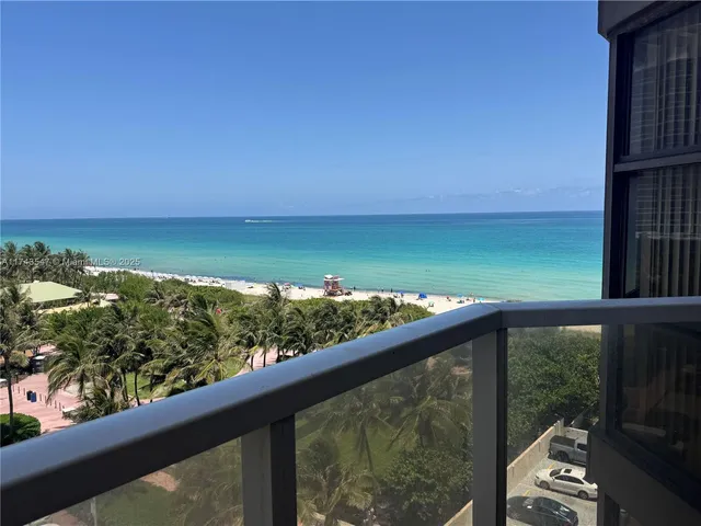 a view of a balcony with an ocean view