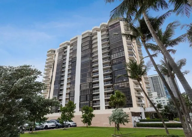 a view of a building with a yard