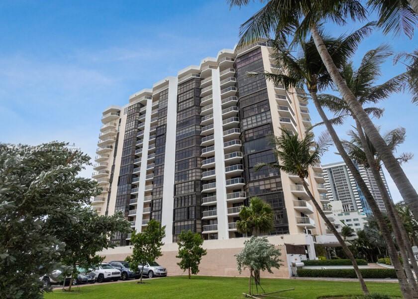6423 Collins Avenue, Unit 809 Miami Beach, FL 33141 - Photo 16 of 18 a view of a building with a yard