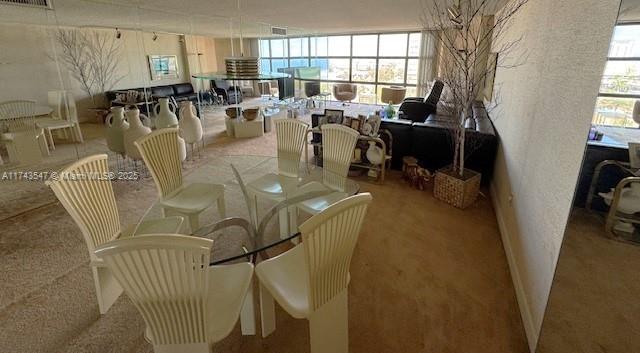 6423 Collins Avenue, Unit 809 Miami Beach, FL 33141 - Photo 5 of 18 a living room with lots of chairs and a chandelier