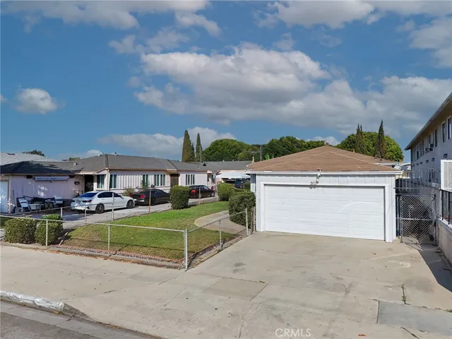 a view of a house with sitting area and a yard