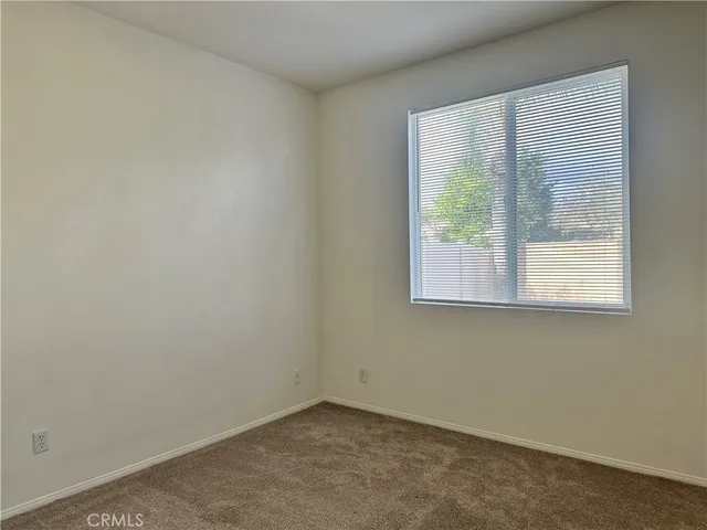 a view of a livingroom with furniture and staircase