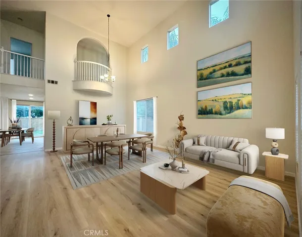 a dining room with furniture and a chandelier