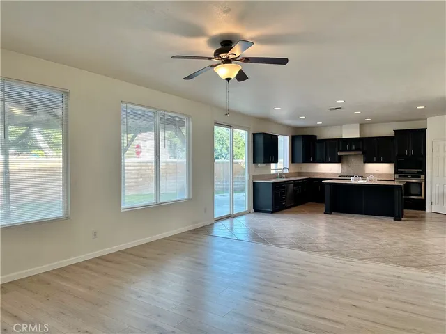 a view of kitchen with cabinets and wooden floor