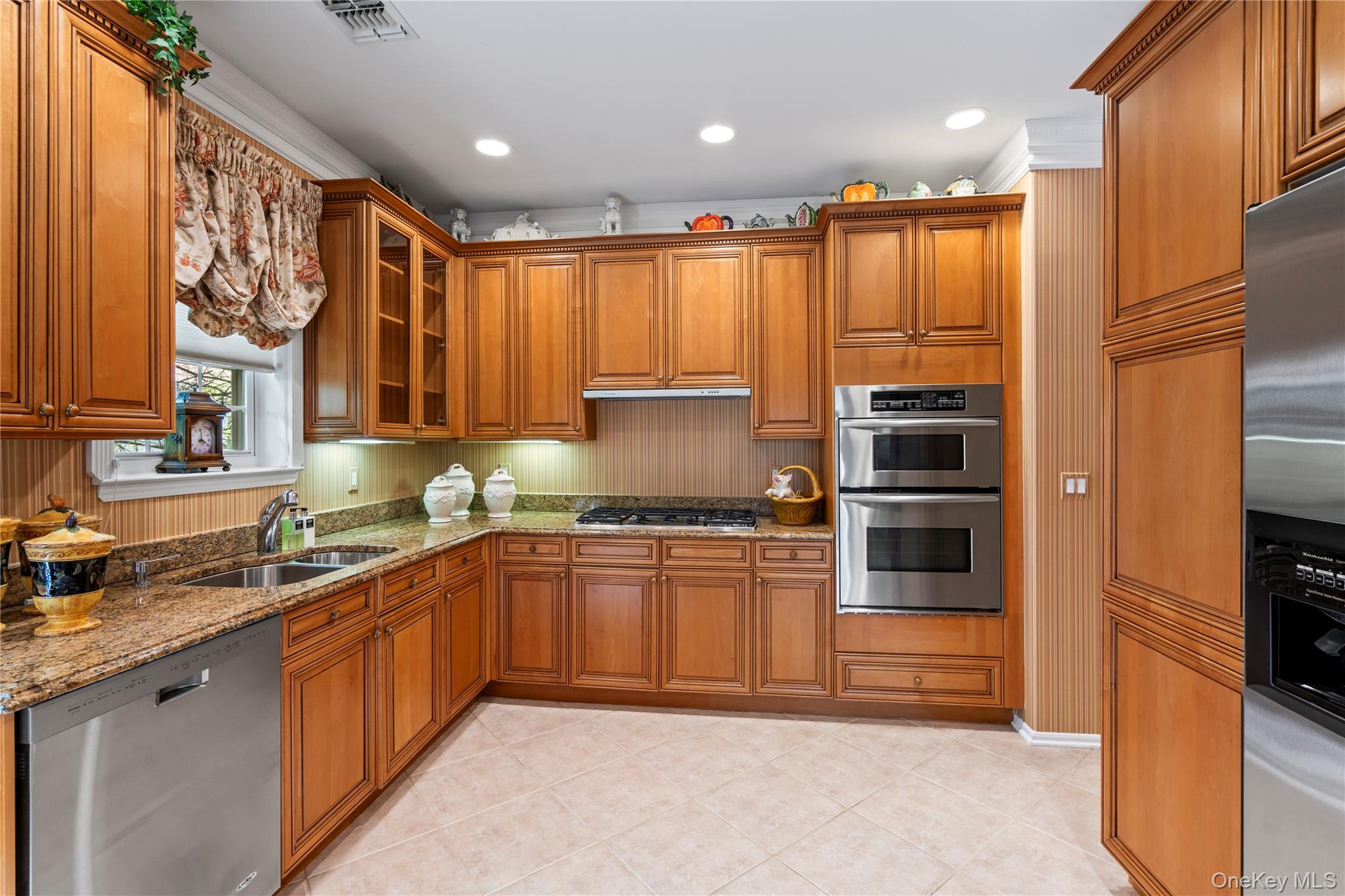 30 Sagamore Drive Plainview, NY 11803 - Photo 13 of 33 a kitchen with stainless steel appliances granite countertop a stove a sink and a refrigerator