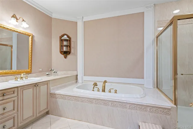 a bathroom with a bathtub and a sink