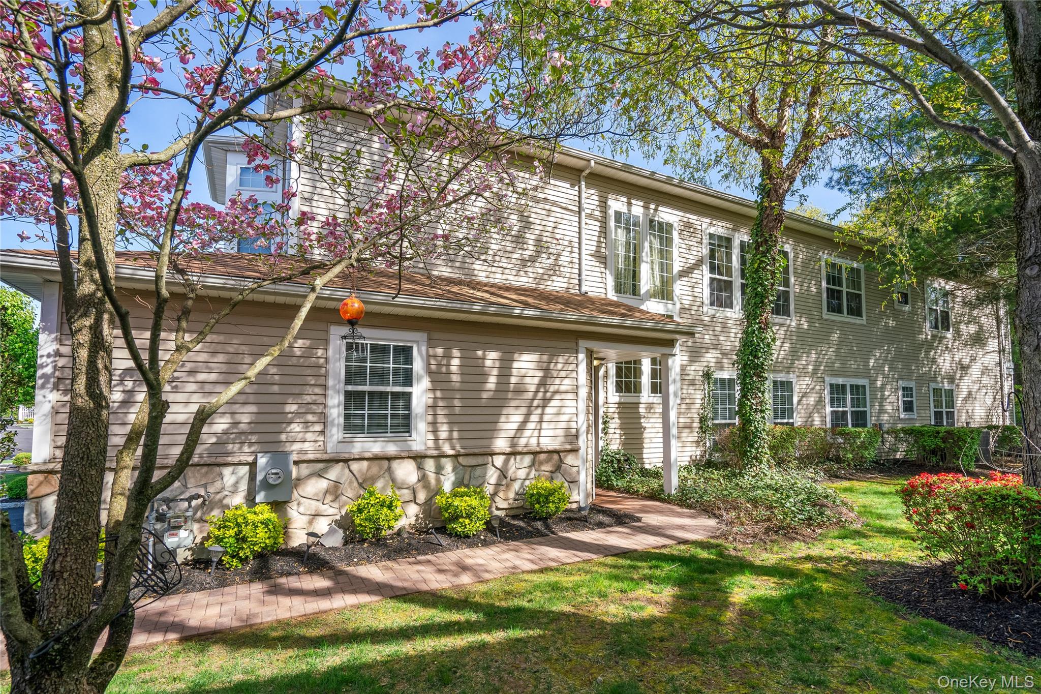 30 Sagamore Drive Plainview, NY 11803 - Photo 3 of 33 a front view of a house with garden