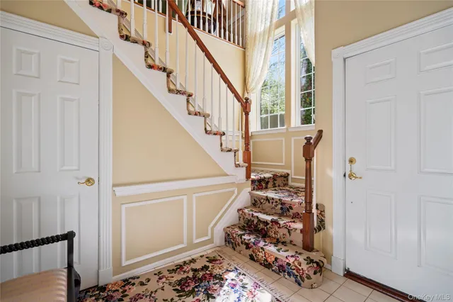 a view of entryway with stairs and furniture
