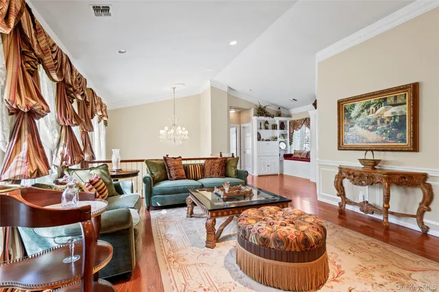 a living room with furniture and a rug