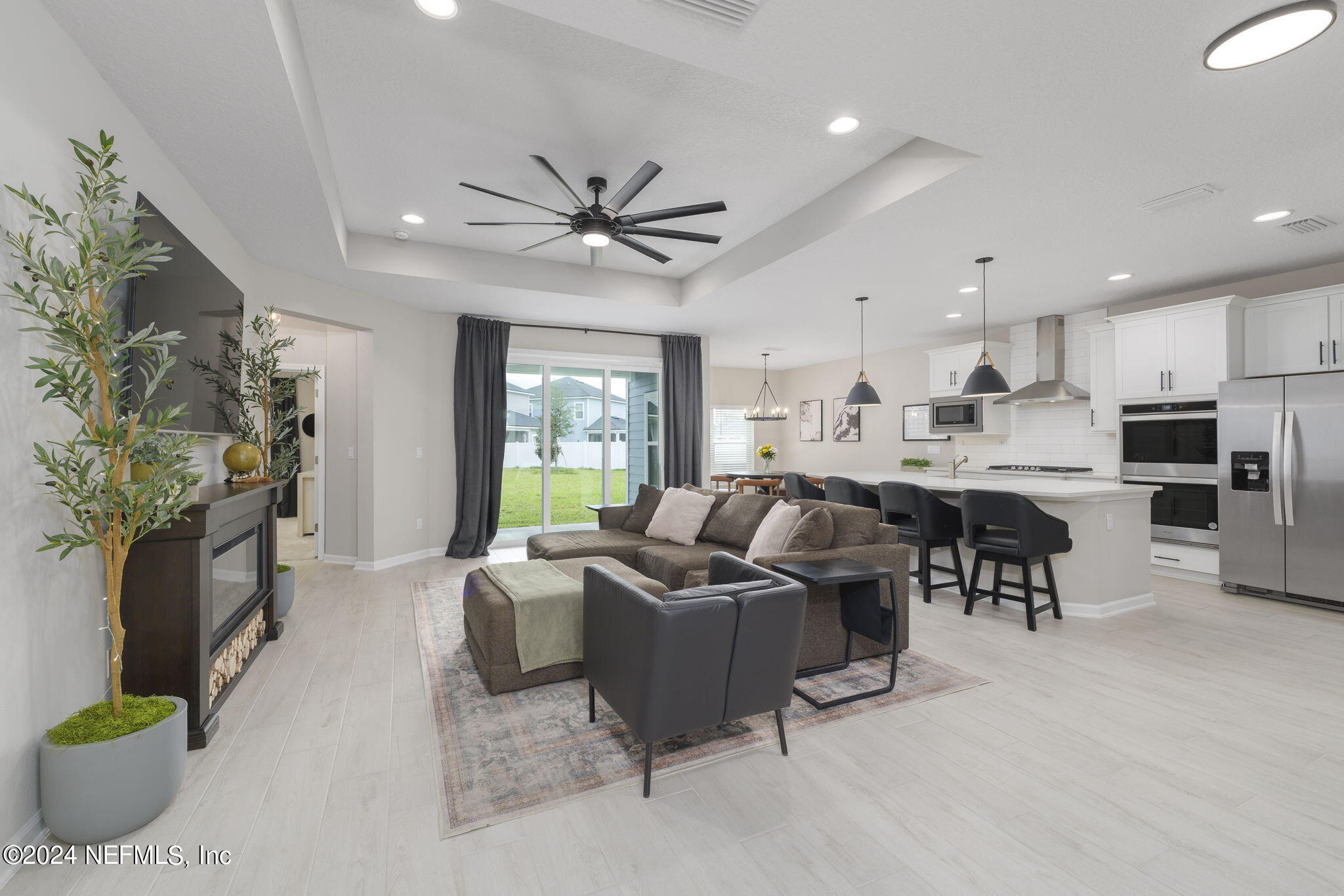 33 Pinzon Pl Street St. Augustine, FL 32095 - Photo 11 of 41 a living room with fireplace furniture and a flat screen tv