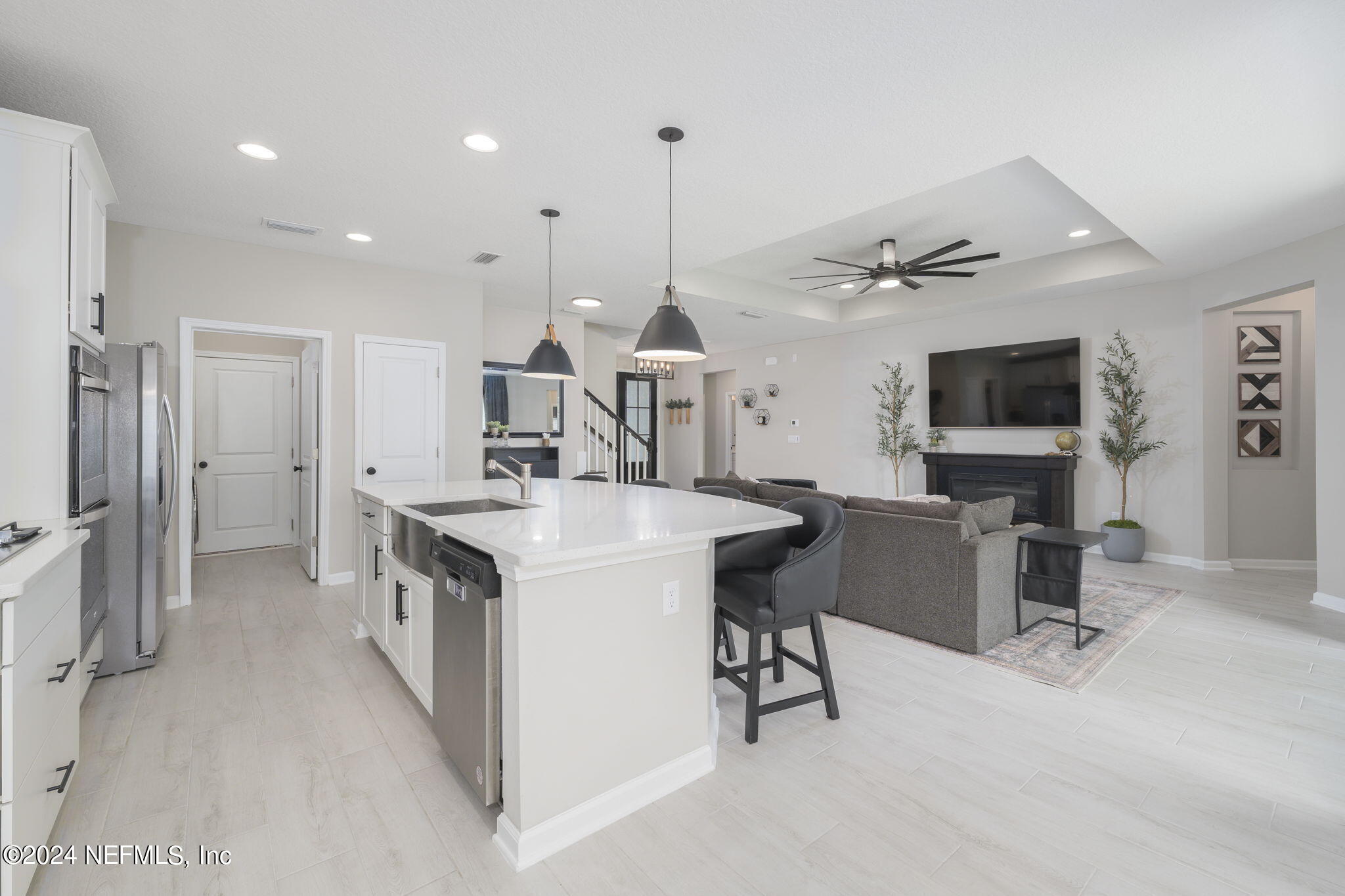 33 Pinzon Pl Street St. Augustine, FL 32095 - Photo 14 of 41 a kitchen with stainless steel appliances kitchen island granite countertop a sink and a refrigerator