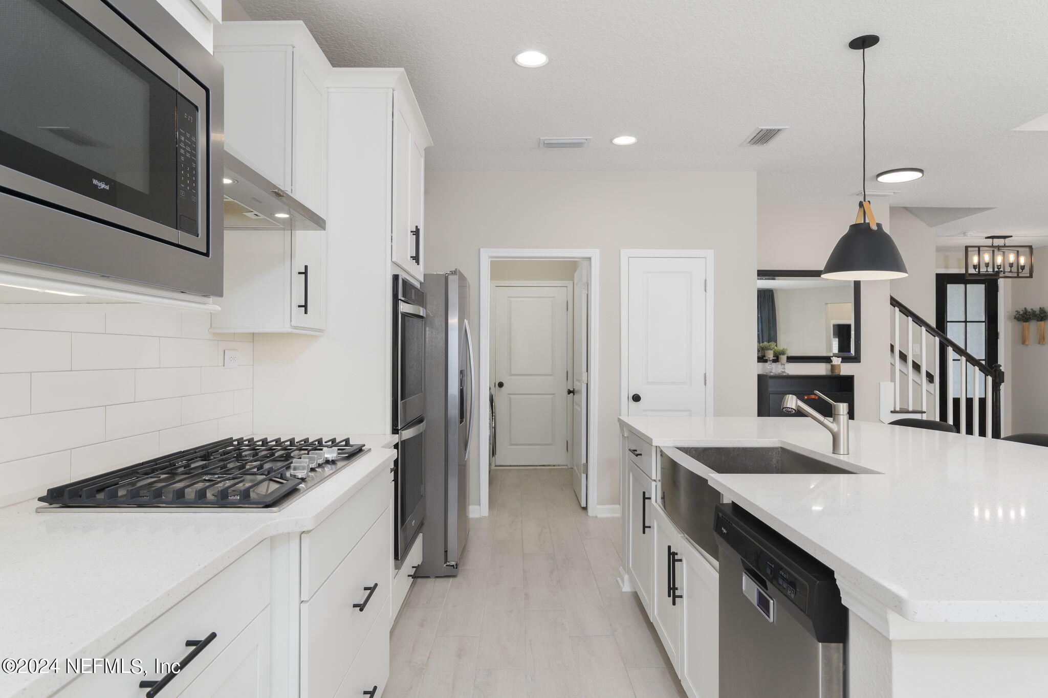 33 Pinzon Pl Street St. Augustine, FL 32095 - Photo 17 of 41 a kitchen with a sink a counter and cabinets