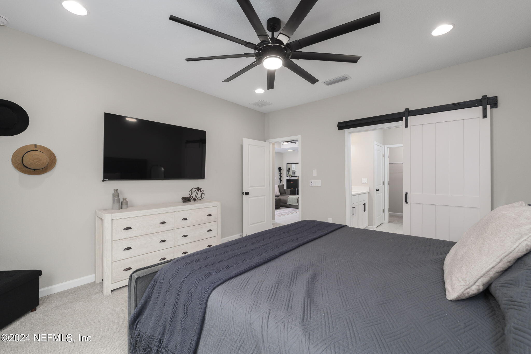 33 Pinzon Pl Street St. Augustine, FL 32095 - Photo 21 of 41 a bedroom with a bed window and a flat screen tv