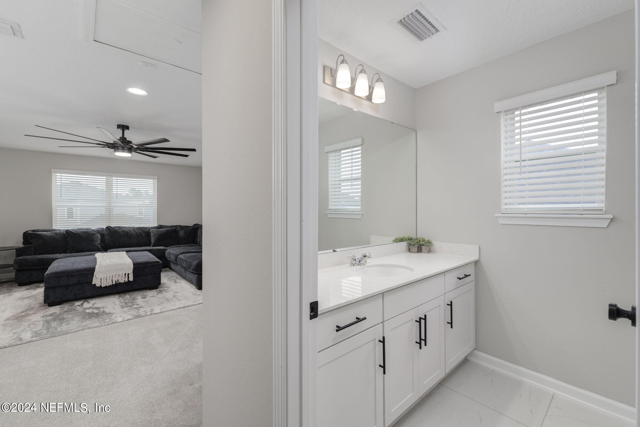 33 Pinzon Pl Street St. Augustine, FL 32095 - Photo 25 of 41 a spacious bathroom with a granite countertop sink a mirror and a bathtub