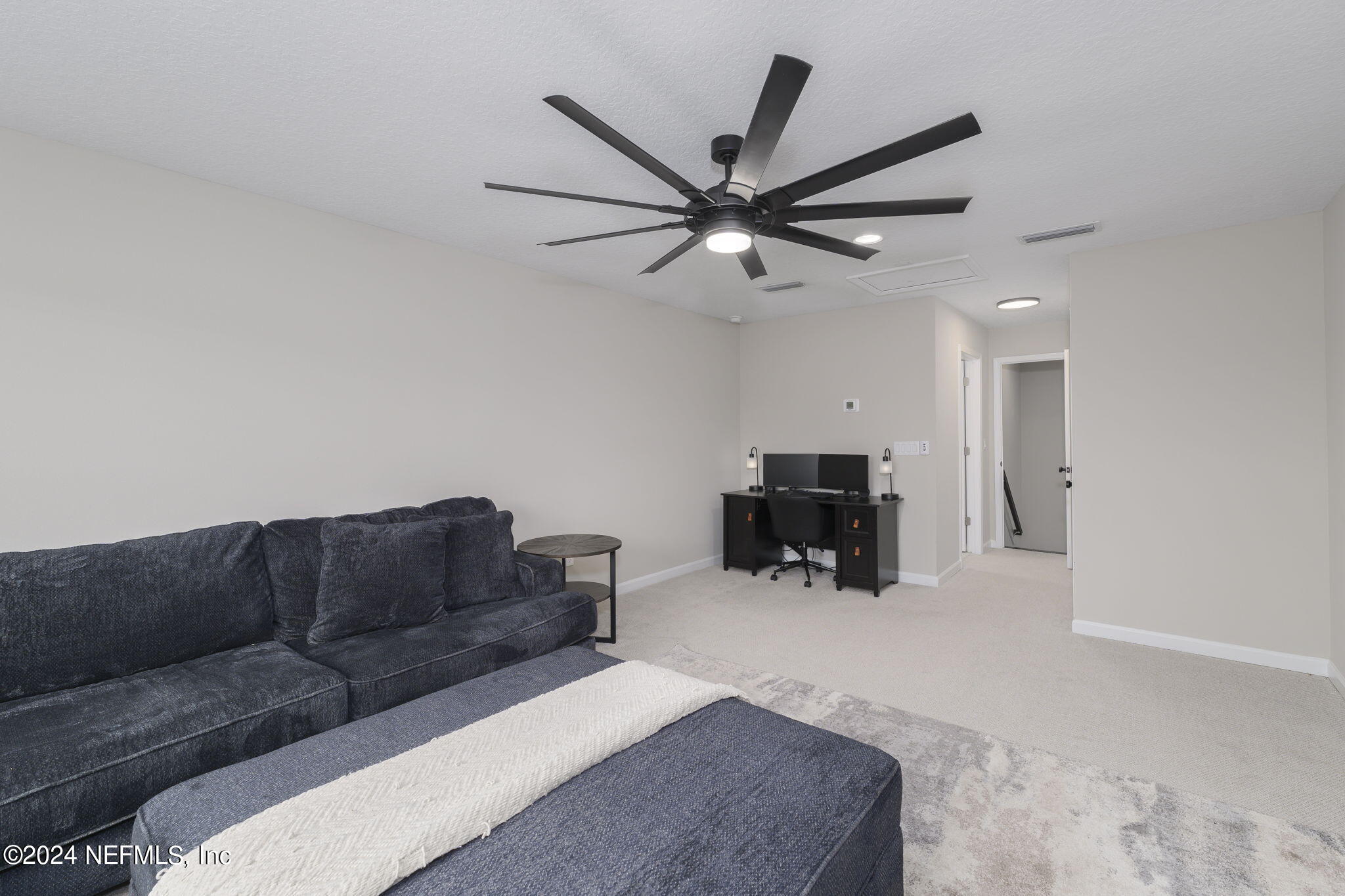 33 Pinzon Pl Street St. Augustine, FL 32095 - Photo 28 of 41 a living room with furniture and a ceiling fan