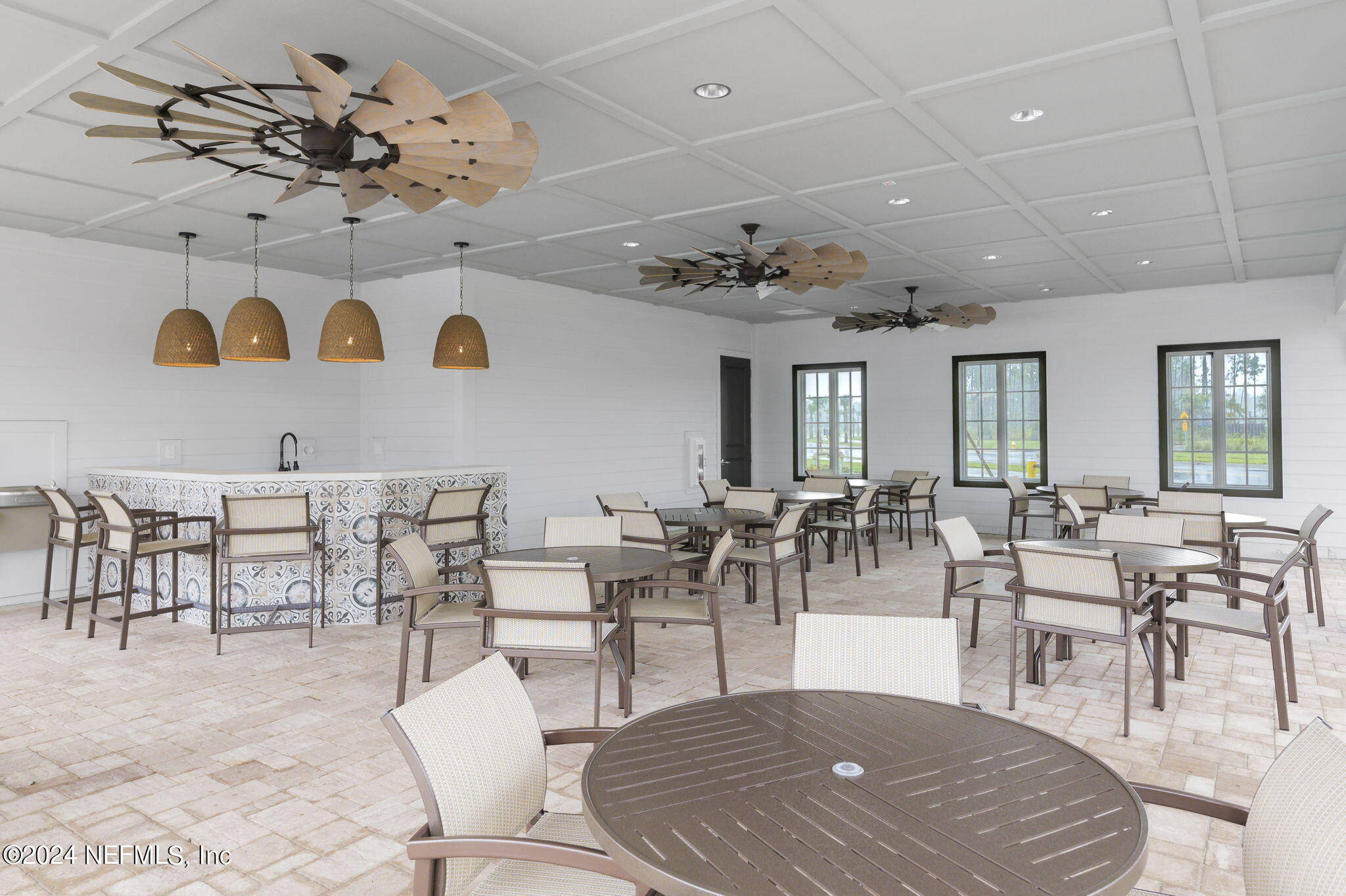 33 Pinzon Pl Street St. Augustine, FL 32095 - Photo 35 of 41 a living room with lots of white furniture and view of kitchen