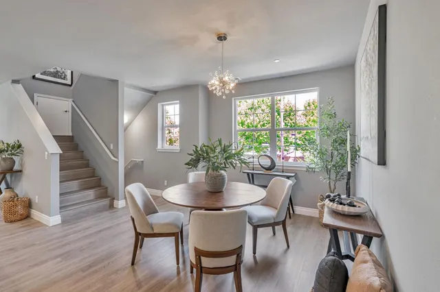 a dining room with furniture window wooden floor